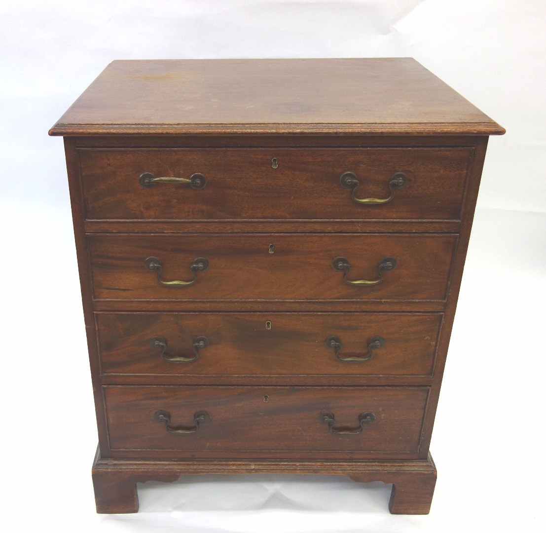 Appraisal: A reproduction George III style mahogany chest fitted with four