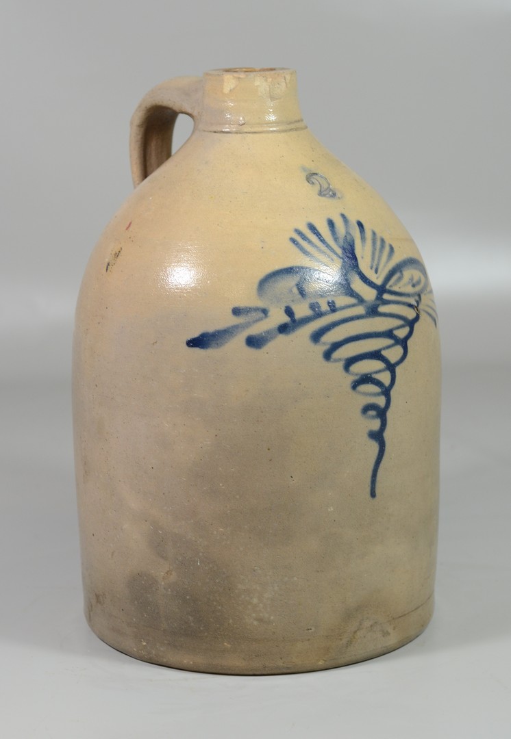 Appraisal: gallon blue decorated stoneware jug dragonfly decoration chips around spout