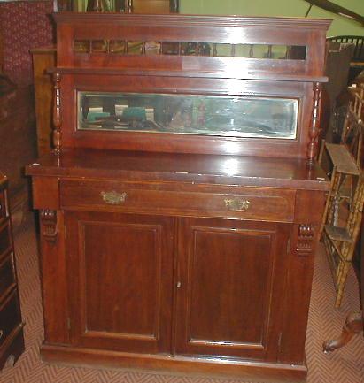 Appraisal: A late Victorian mahogany chiffonier with gallery and mirror back