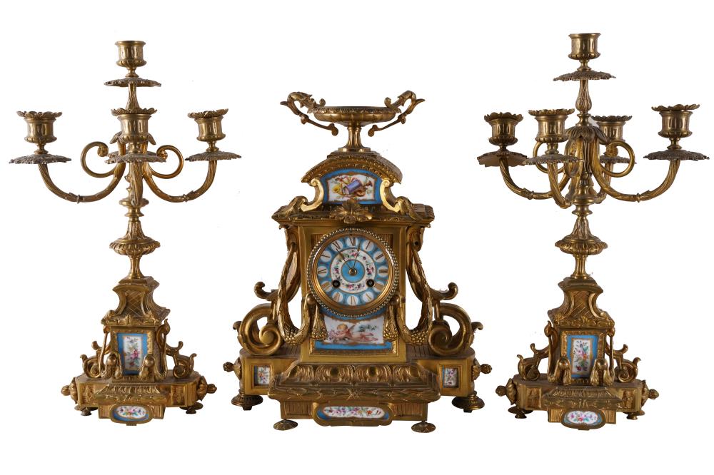 Appraisal: GILT METAL PORCELAIN MANTLE CLOCK GARNITURE SET th century the