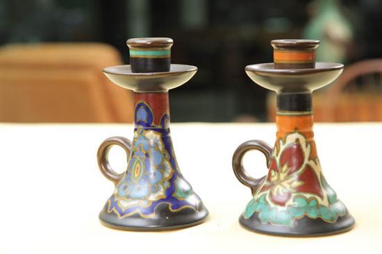 Appraisal: TWO SIMILAR GOUDA CHAMBERSTICKS Circa and Tapered sticks with polychrome