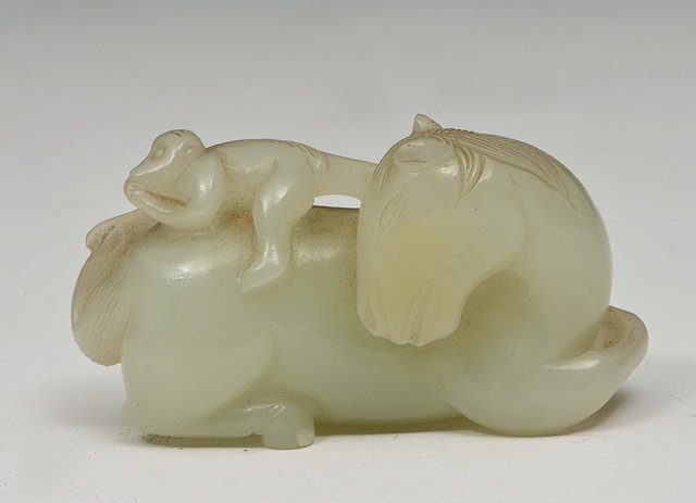 Appraisal: A CHINESE PALE GREEN JADE 'Horse and monkey group' the