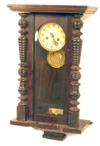 Appraisal: A thC mahogany wall clock with turned pilasters cream numeric