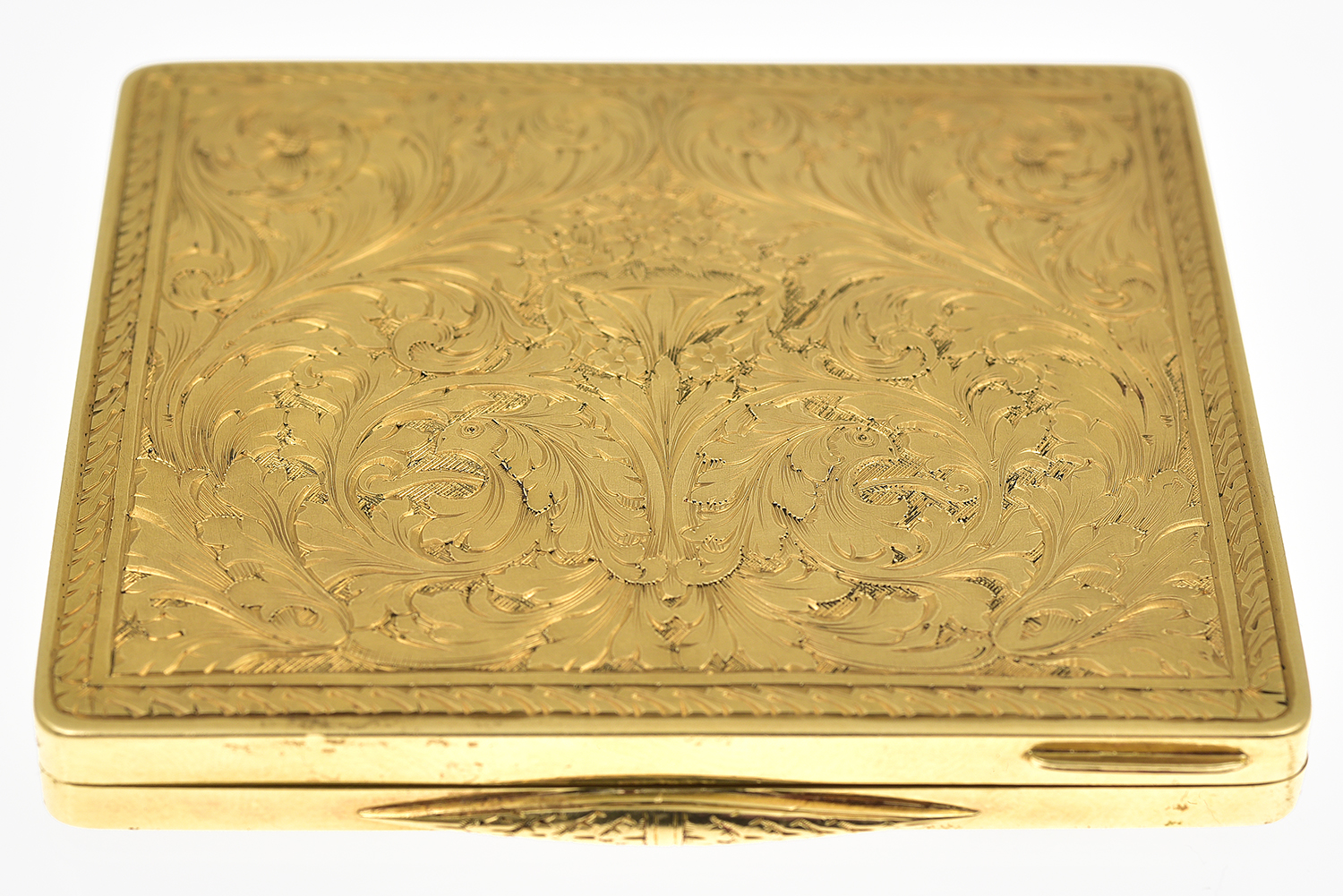 Appraisal: A GOLD CASE The rectangular hinged case having finely chased