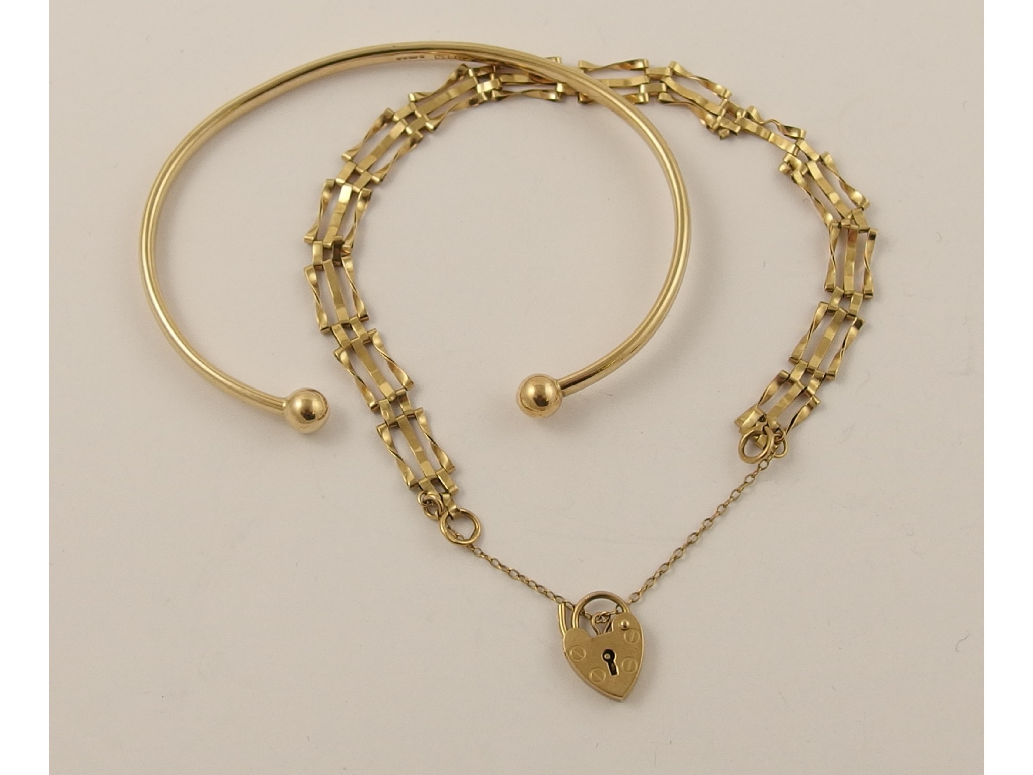 Appraisal: A ct bangle together with a ct gate bracelet approx