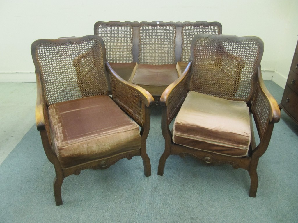 Appraisal: Bergere lounge suite three pieces and a glass fronted cabinet