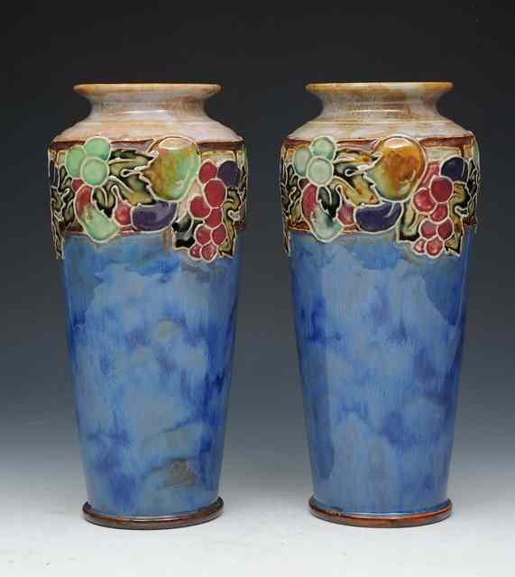 Appraisal: A pair of Royal Doulton stoneware vases baluster form decorated