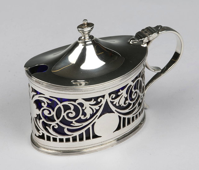 Appraisal: AN EDWARDIAN OVAL SHAPED SILVER MUSTARD POT with pierced scroll