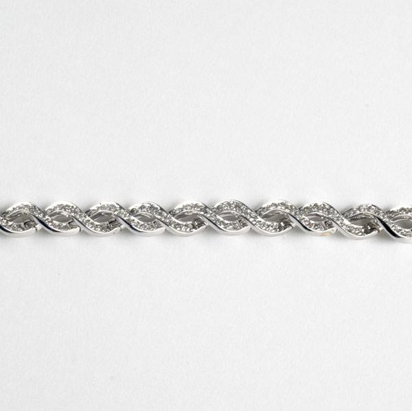 Appraisal: DIAMOND BRACELET k wg Flexible continuous links designed as twisted