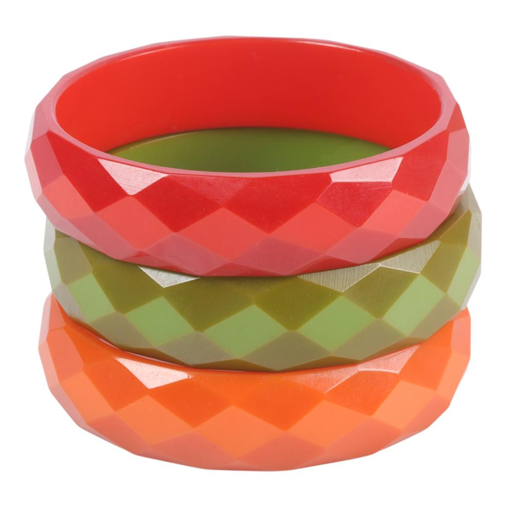 Appraisal: THREE BAKELITE BANGLE BRACELETS WITH FACETED DESIGN H X W