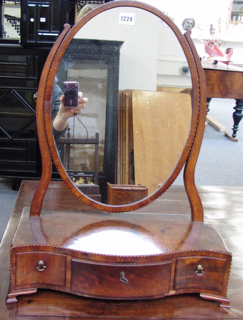 Appraisal: An early th century inlaid mahogany toilet mirror with serpentine