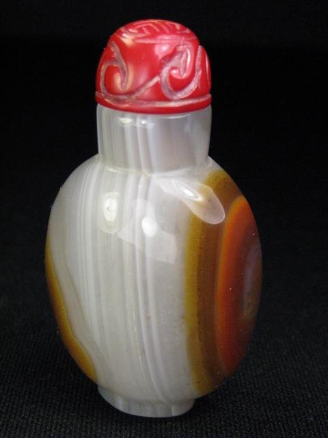 Appraisal: Polished grey colored agate snuff bottle with carved red stopper