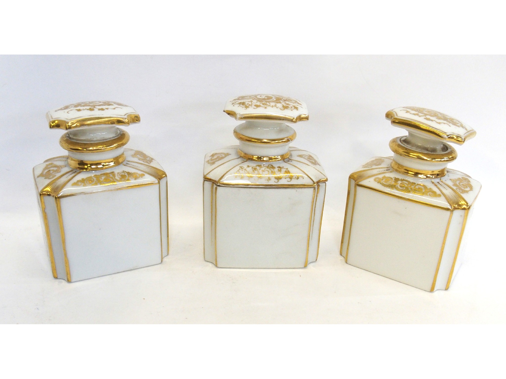 Appraisal: A Victorian cased set of three porcelain scent bottles with