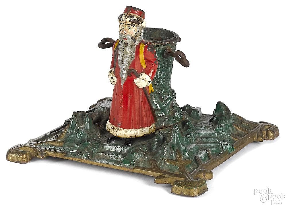 Appraisal: German painted cast iron Christmas tree stand German painted cast