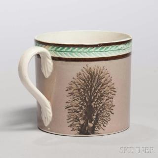 Appraisal: Mocha-decorated Creamware Child's Mug England c with black mocha trees