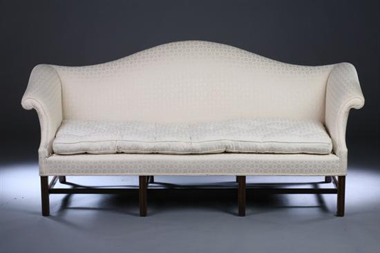 Appraisal: CHIPPENDALE STYLE CAMELBACK EIGHT-LEG SOFA th century with cream diapered