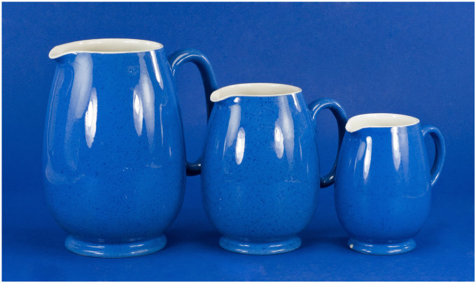 Appraisal: Moorcroft Set of Three Graduated Jugs Coloured blue and cream