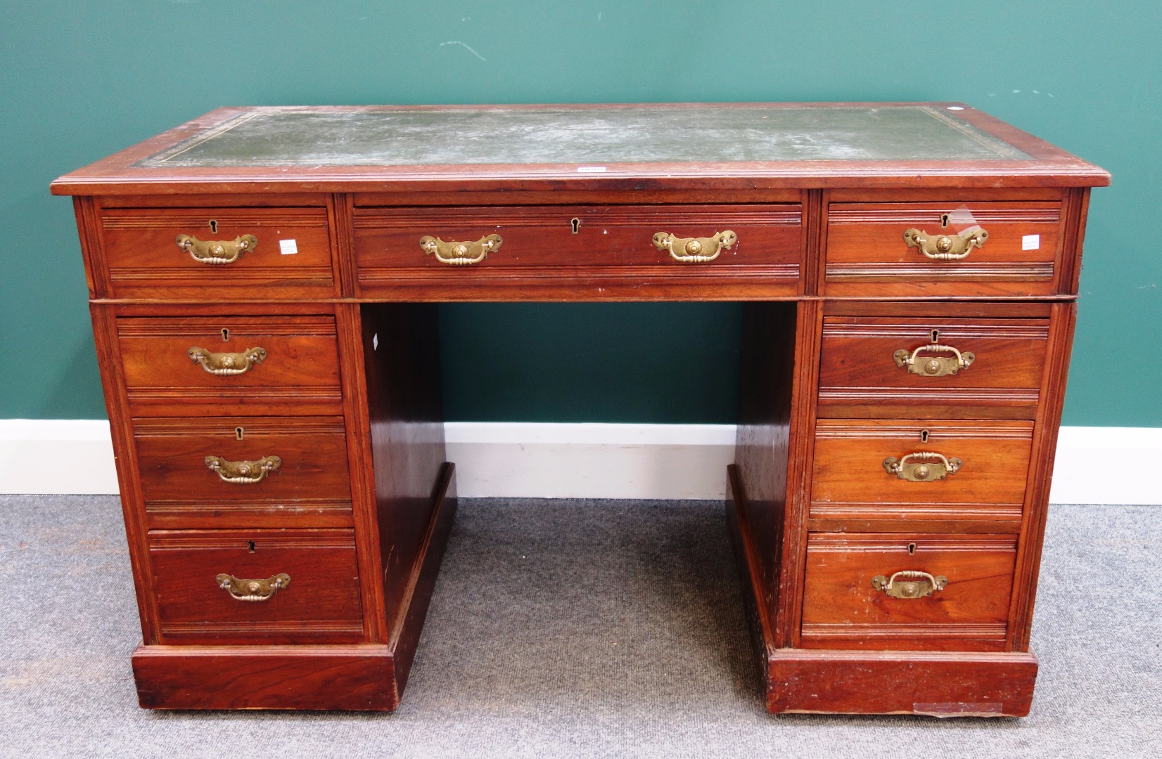 Appraisal: A late th century walnut pedestal desk with nine drawers