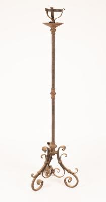 Appraisal: A wrought iron floor standing pricket candlestick on scroll tripod