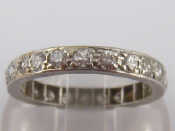 Appraisal: A platinum and diamond eternity ring size L mm wide