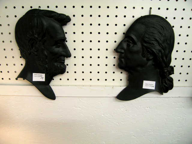 Appraisal: Cast Iron Wall Plaques bust of Lincoln Washington