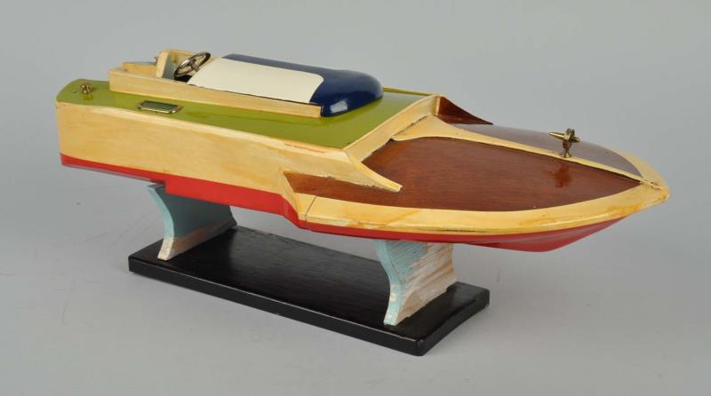 Appraisal: Japanese Wooden Battery-Operated Speedboat Includes wooden stand Made by Ito