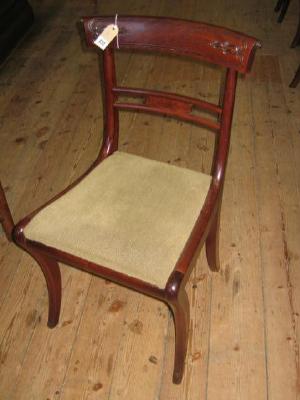 Appraisal: A SET OF FOUR REGENCY MAHOGANY DINING CHAIRS with leaf