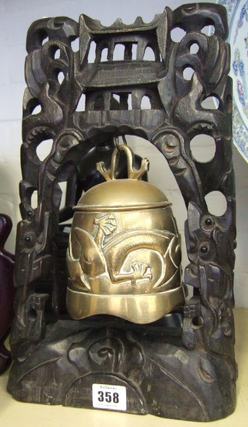 Appraisal: A brass temple bell modern decorated in relief with a