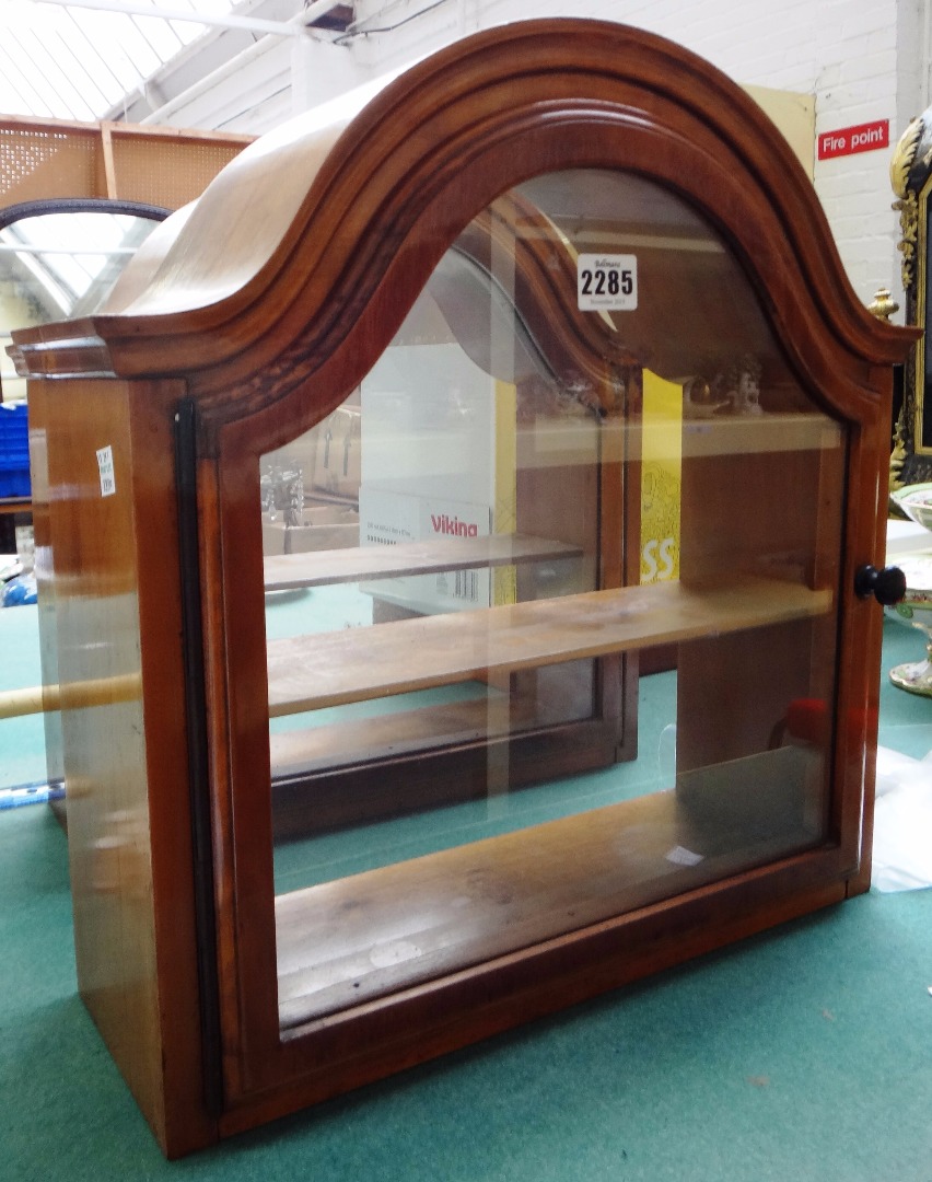 Appraisal: A pair of walnut framed glazed hanging display cabinets each