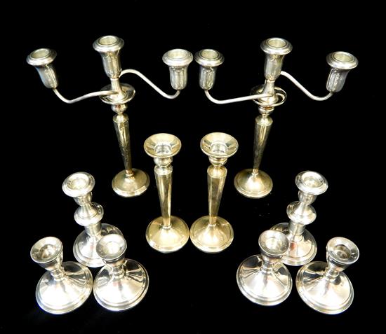 Appraisal: STERLING ten weighted pieces four short candleholders h four candlesticks