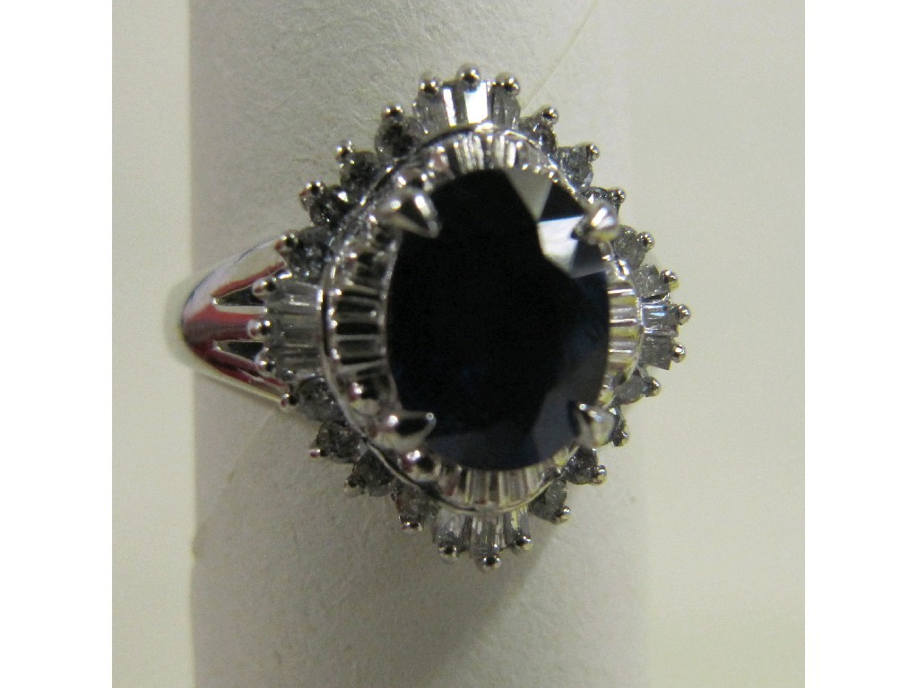 Appraisal: Eighteen carat white gold sapphire and diamond cluster ring with