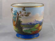 Appraisal: A ceramic jardinaire hand painted with landscape scene cm diameter