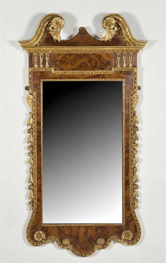 Appraisal: Georgian parcel-gilt burl walnut mirror circa broken arch pediment with