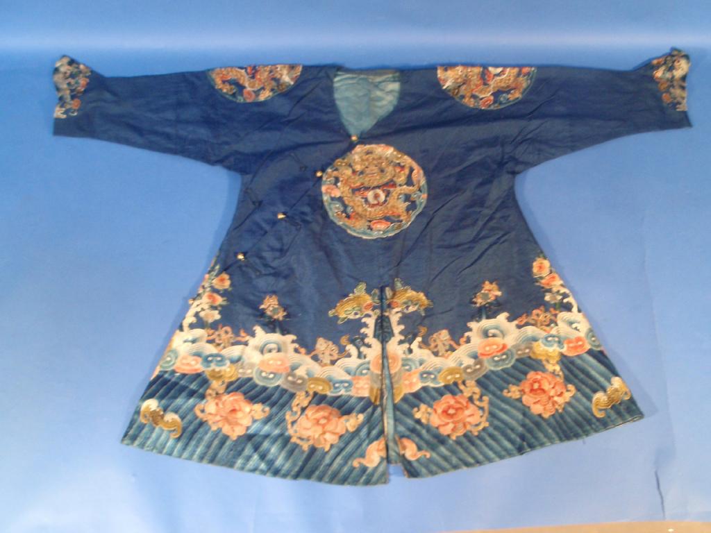 Appraisal: A Chinese silk jacket embellished with serpents flora and decorative