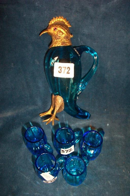 Appraisal: A blue glass decanter in the form of a bird