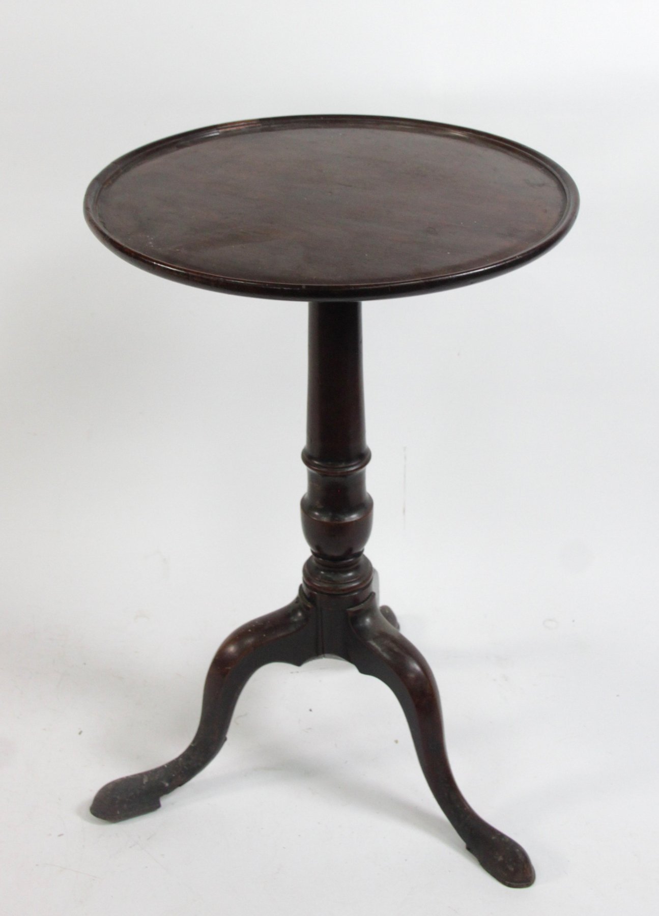 Appraisal: A mahogany and oak tripod table with dished top cm