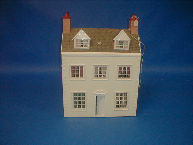 Appraisal: A modern dolls house with opening front