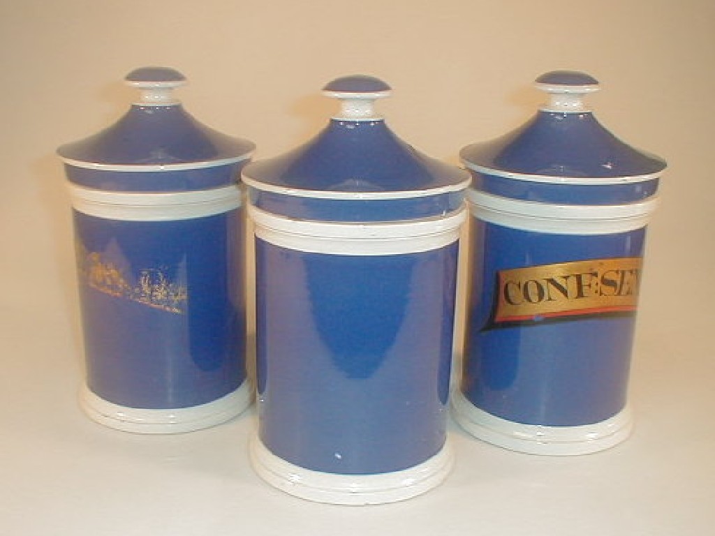 Appraisal: A thC blue ground pottery chemist's jar of cylindrical form