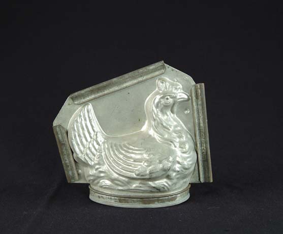 Appraisal: TIN CHICKEN ON NEST CHOCOLATE MOLD Marked France Complete with