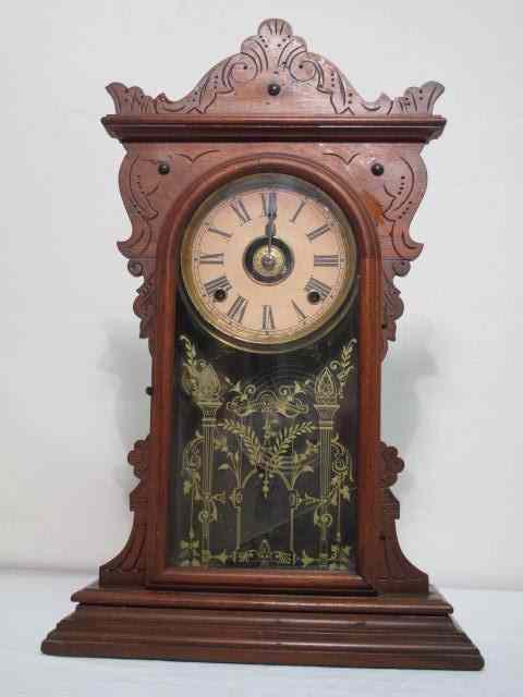 Appraisal: American gingerbread style clock Eight day brass mechanism Original label