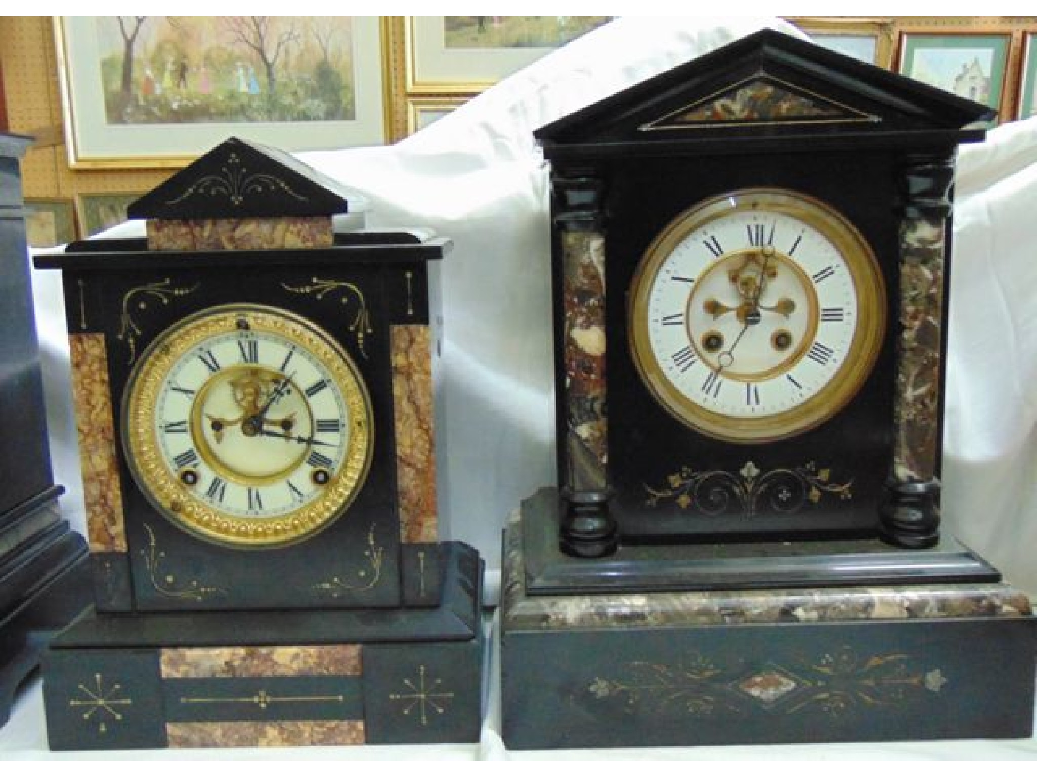 Appraisal: A Victorian black slate and polished marble mantle clock with