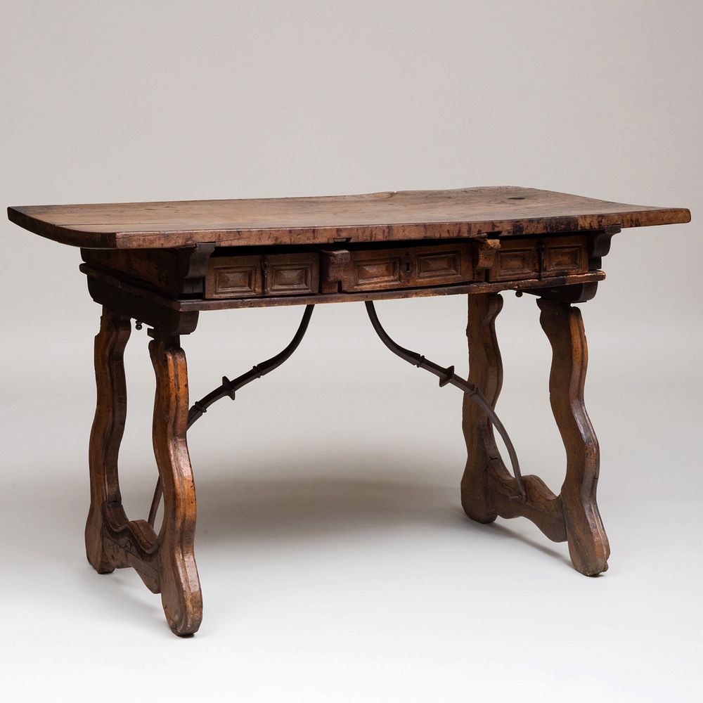 Appraisal: Spanish Baroque Style Walnut and Wrought-Iron Table Fitted with three