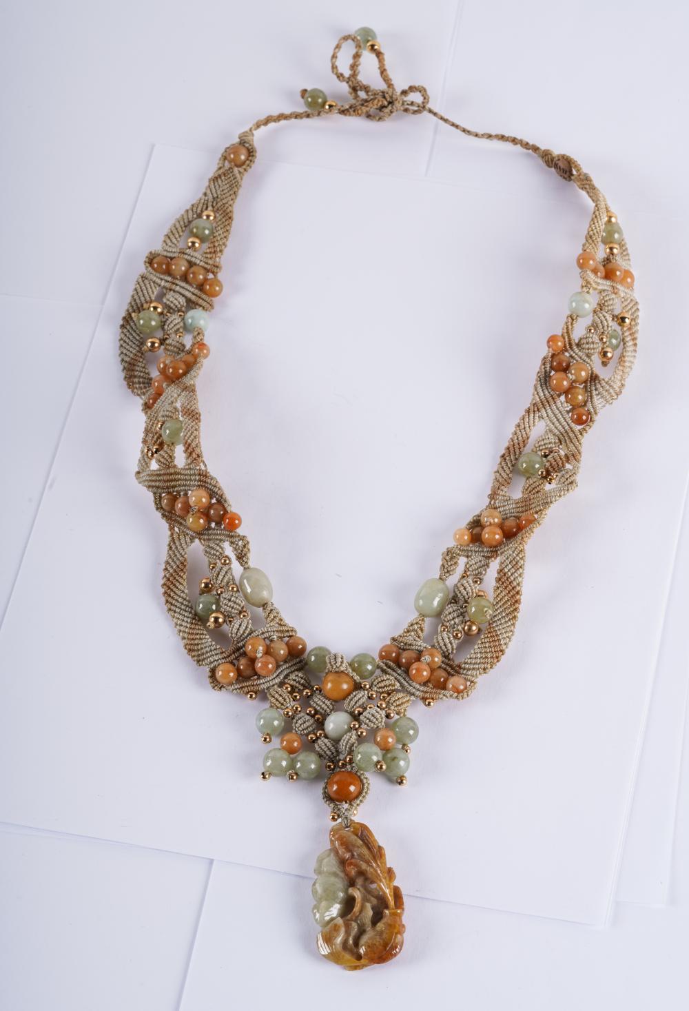 Appraisal: KARAT YELLOW GOLD JADE BEADED NECKLACEcirca with Chinese carved jade