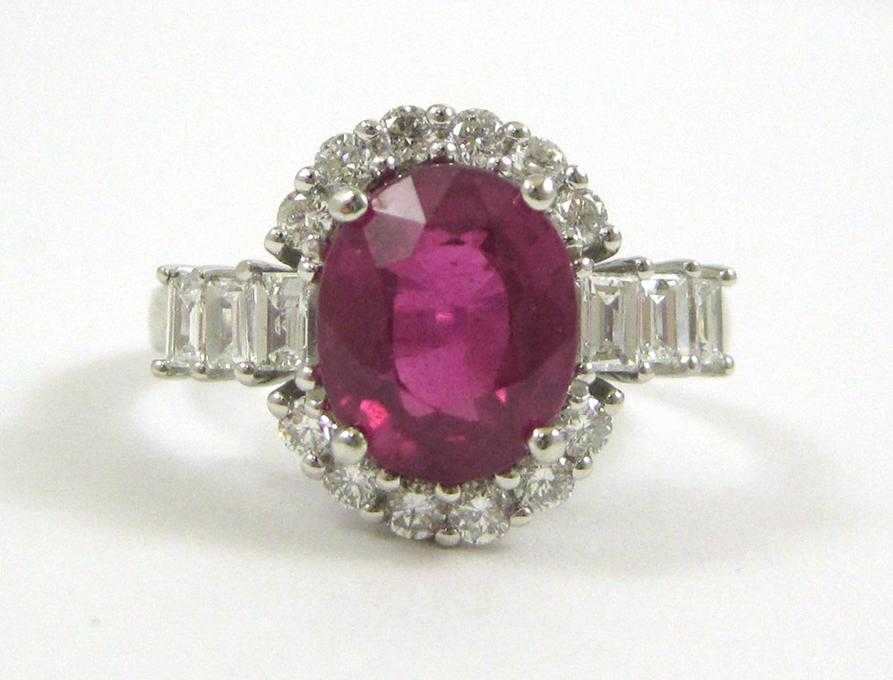 Appraisal: PINK SAPPHIRE AND FOURTEEN KARAT WHITE GOLD RING with twelve