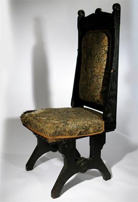 Appraisal: An Aesthetic Movement ebonised wood high-back chair in the manner