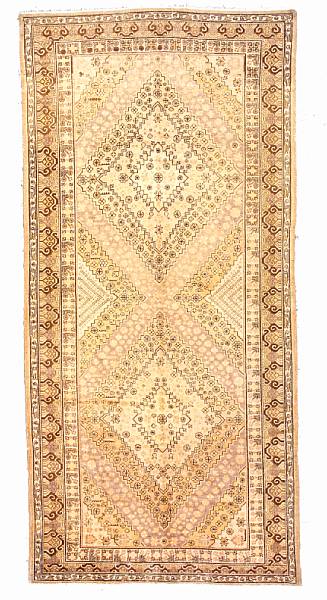 Appraisal: A Khotan long carpet Turkestan late th century size approximately