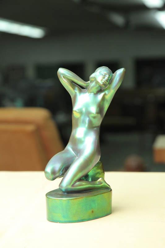 Appraisal: ZSOLNAY FIGURINE Green iridescent stretching nude on an oval base