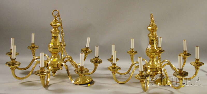 Appraisal: Pair of Georgian-style Brass Eight-light Chandeliers with Eight Cylindrical Colorless