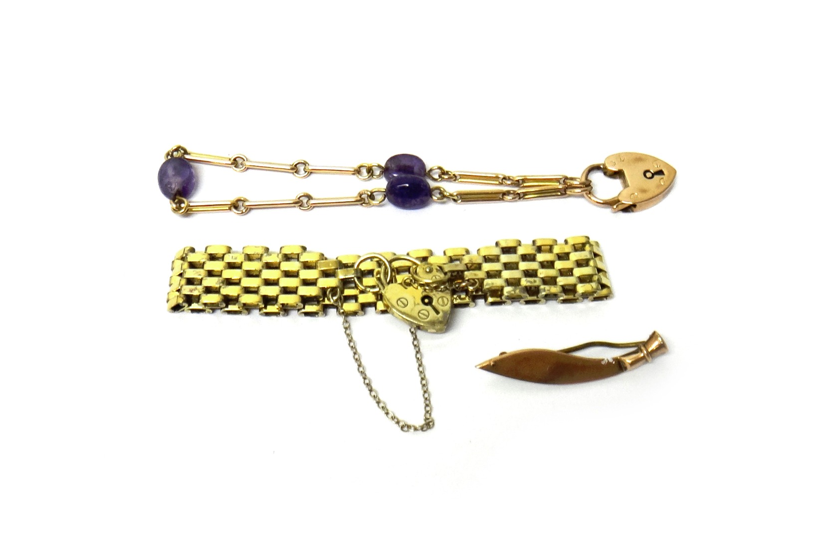 Appraisal: A gold and amethyst quartz bracelet in a bar and