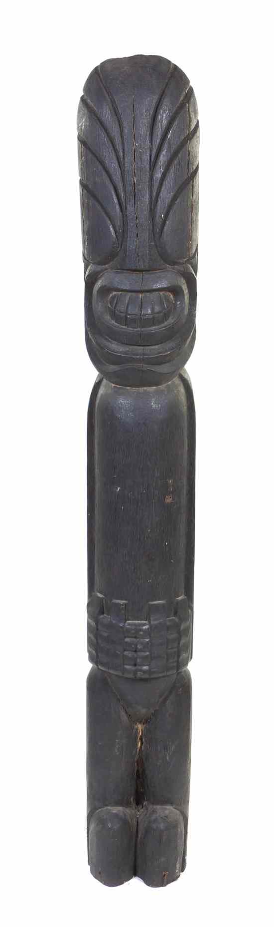 Appraisal: A Carved Wood Tiki Totem depicting a stylized figure with